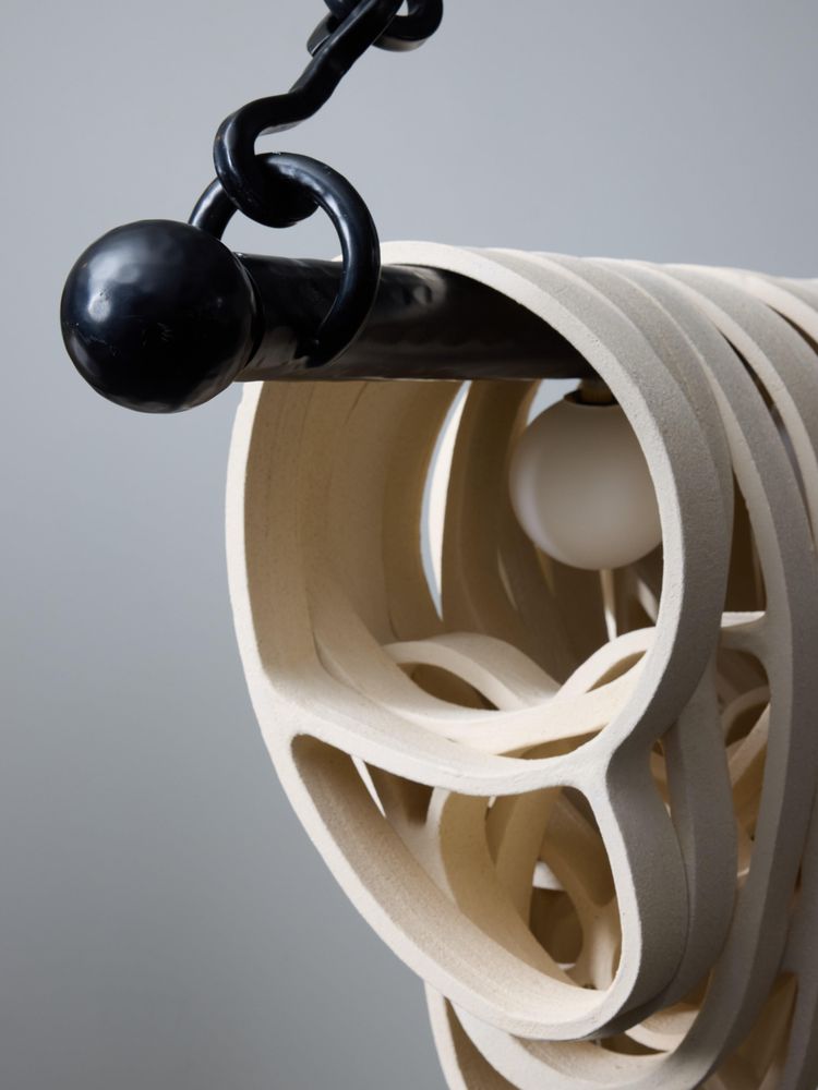 Long iron and ceramic chandelier by Olivia Cognet