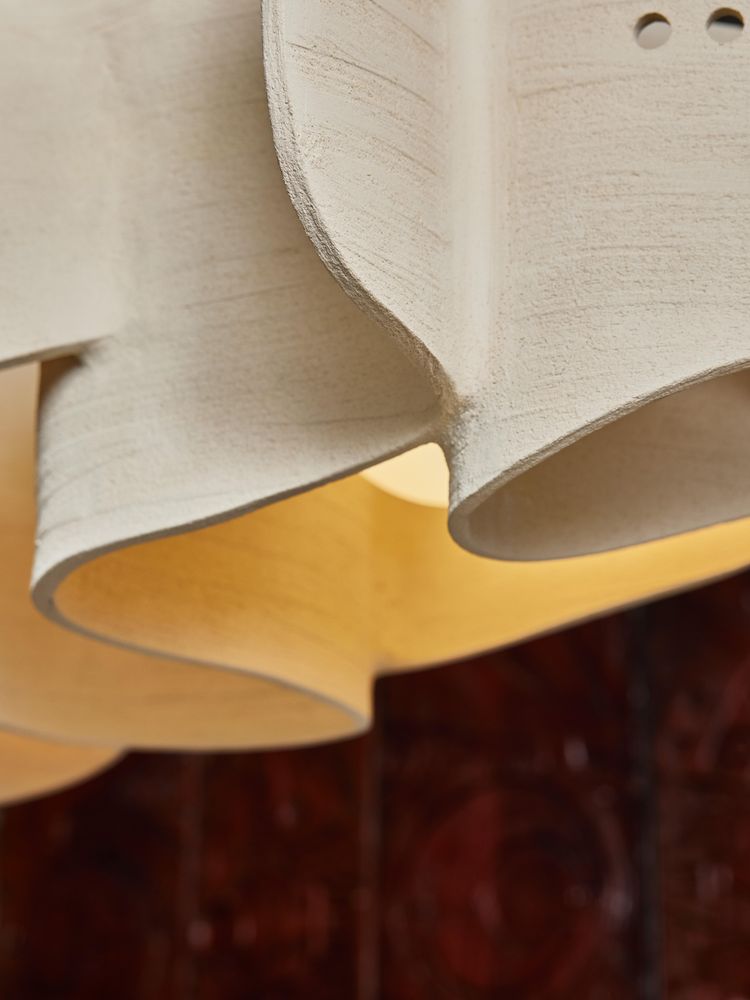 Long ceramic chandelier by Olivia Cognet
