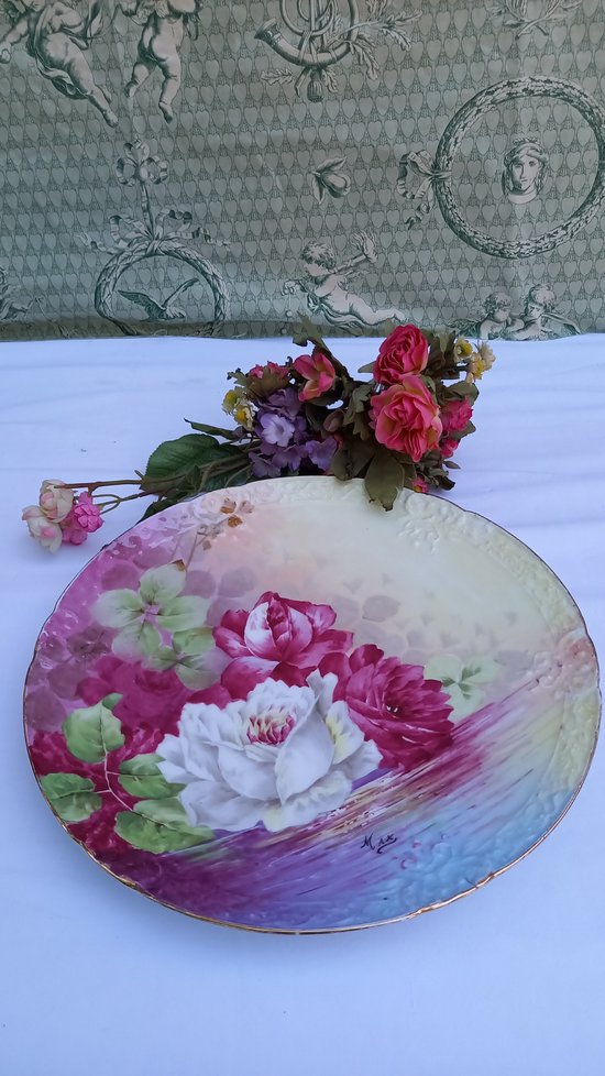 Decorative plates in Limoges porcelain from the 20th century