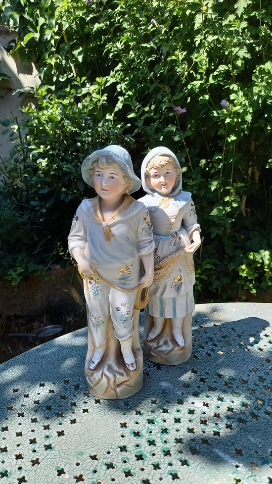 19th century porcelain biscuit statuettes