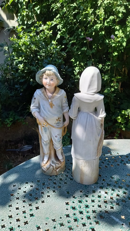 19th century porcelain biscuit statuettes