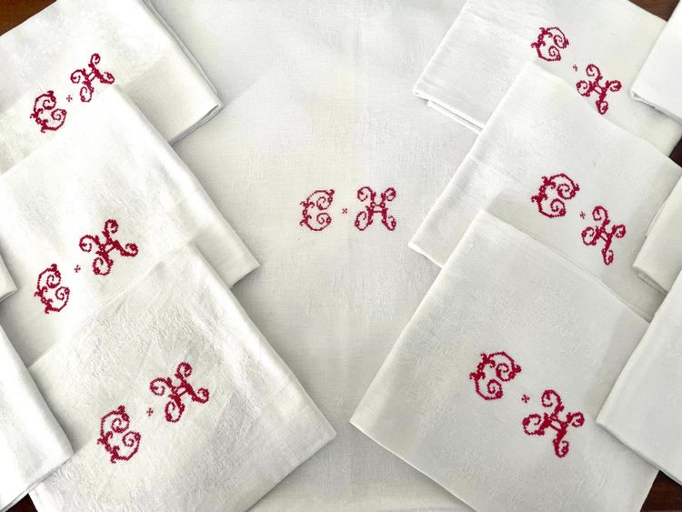 Antique white damask monogrammed embroidered tablecloth and its 12 napkins
