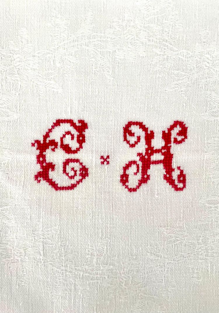 Antique white damask monogrammed embroidered tablecloth and its 12 napkins
