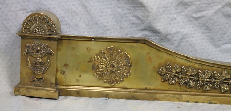 Bronze and brass fireplace surround from the Empire period, early 19th century.