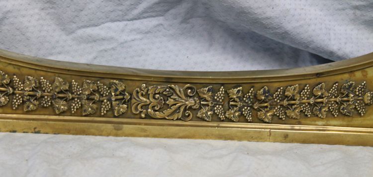 Bronze and brass fireplace surround from the Empire period, early 19th century.