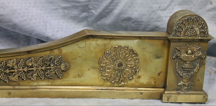 Bronze and brass fireplace surround from the Empire period, early 19th century.