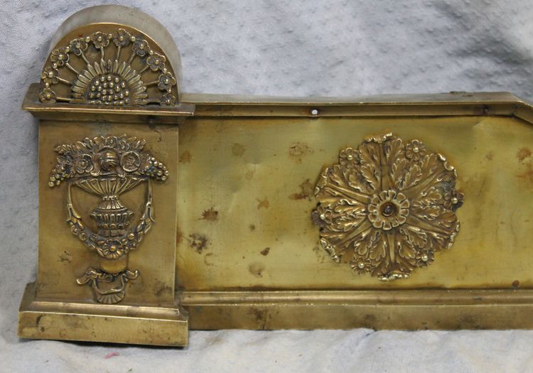 Bronze and brass fireplace surround from the Empire period, early 19th century.