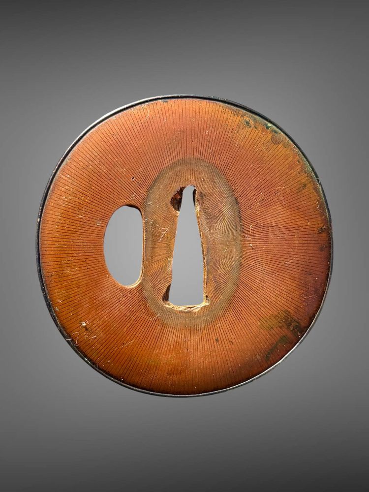 Tsuba maru-gata in suaka e shakudo - Periodo Edo (1603-1868).