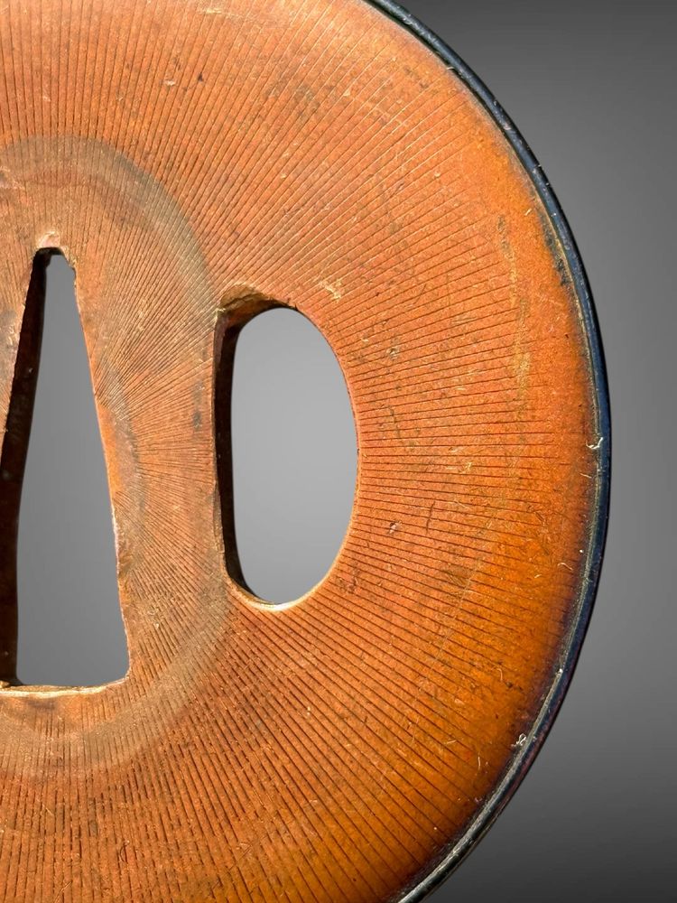 Tsuba maru-gata in suaka e shakudo - Periodo Edo (1603-1868).