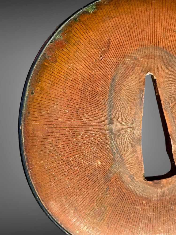 Tsuba maru-gata in suaka e shakudo - Periodo Edo (1603-1868).