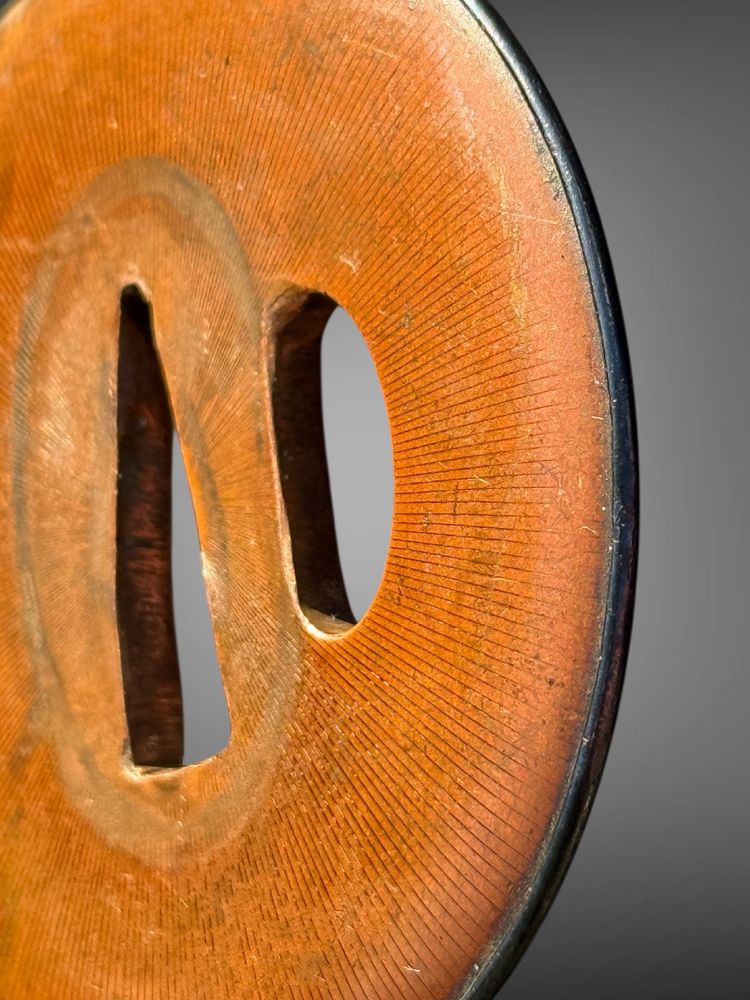 Tsuba maru-gata in suaka e shakudo - Periodo Edo (1603-1868).