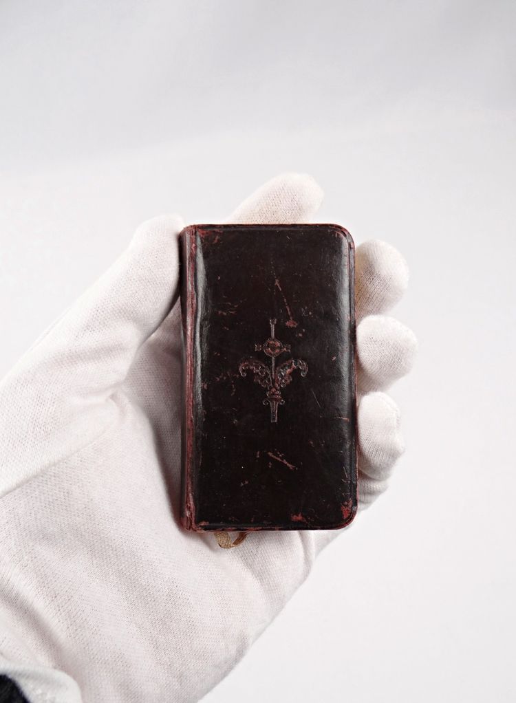 A small, pocket-sized parishioner's book, complete with offices and prayers during Holy Mass.