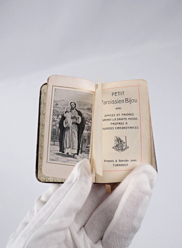 A small, pocket-sized parishioner's book, complete with offices and prayers during Holy Mass.