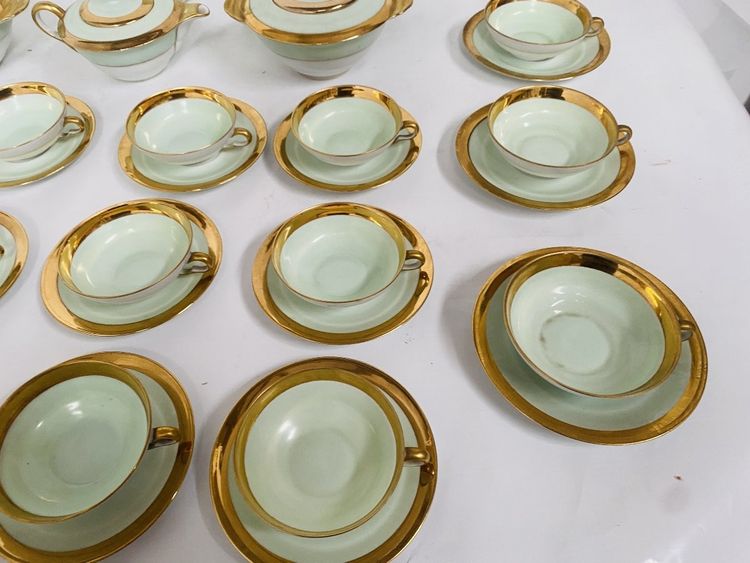 Coffee and tea service comprising 25 pieces in polychrome porcelain. 20th century.