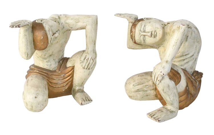 Coffee table with two figures holding a glass tray