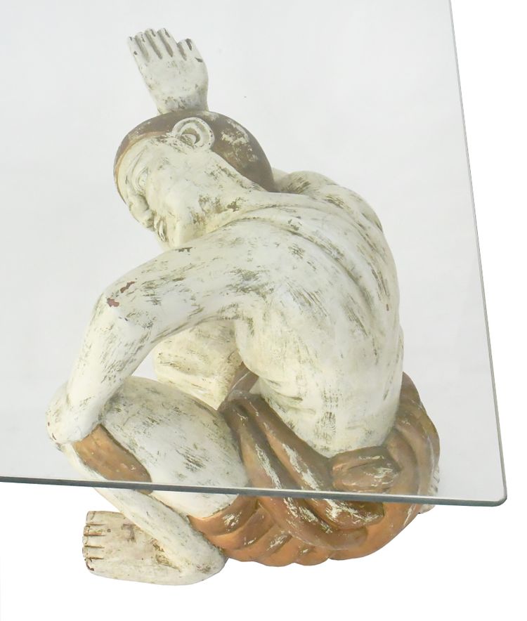 Coffee table with two figures holding a glass tray
