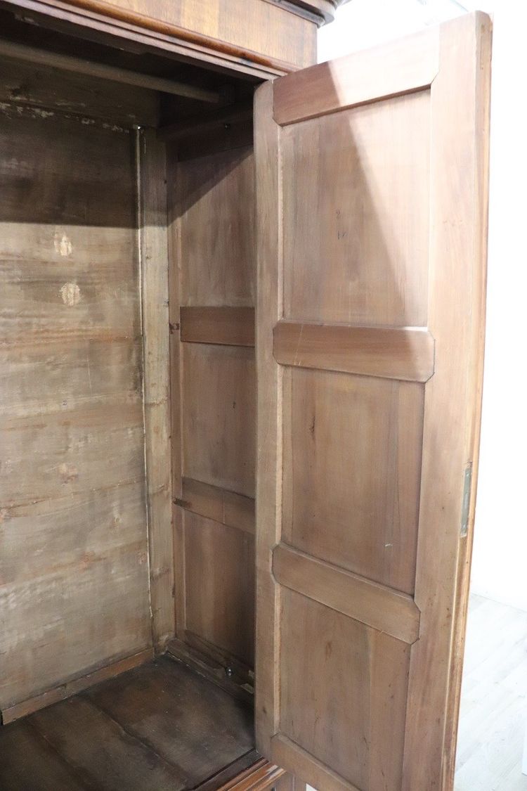 Very large 4 doors waedrobe in solid walnut, Italy Mid 19th century