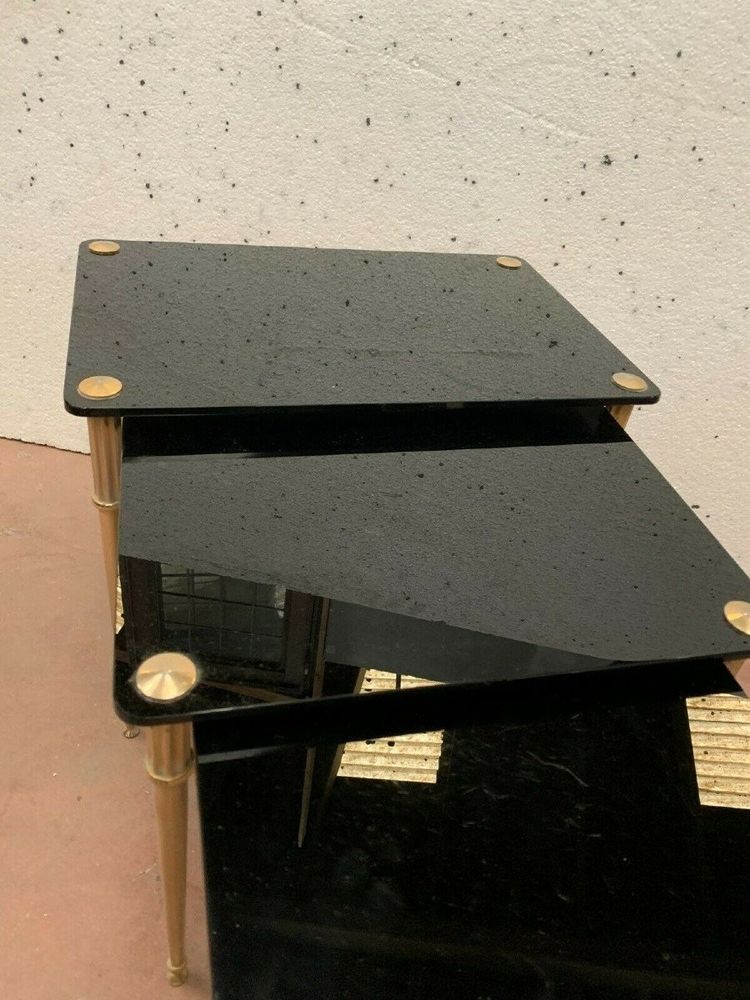 Tavolini impilabili in ottone e vetro nero, XX secolo