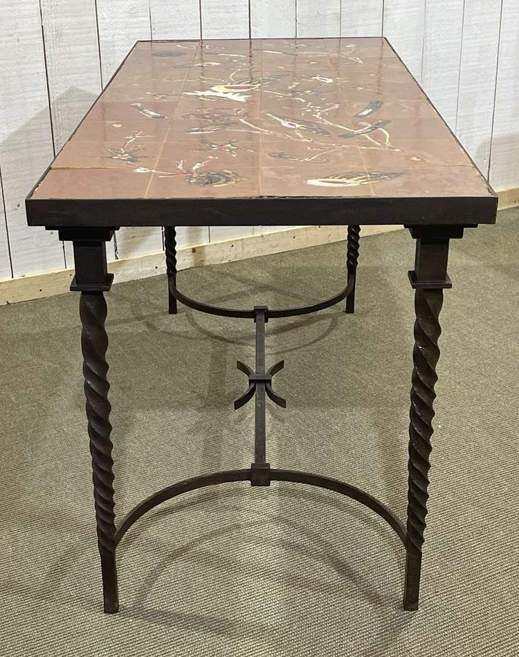 Wrought iron console table with a tiled earthenware top decorated with a seabed scene