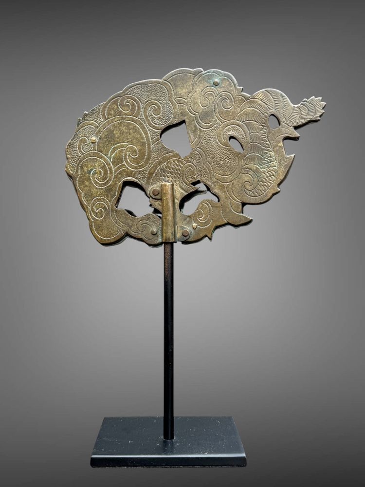 Embossed and finely engraved copper maedate featuring a dragon in clouds - Edo period. -