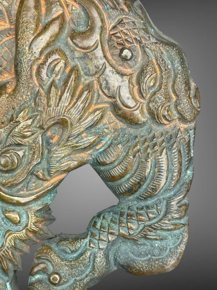 Embossed and finely engraved copper maedate featuring a dragon in clouds - Edo period. -