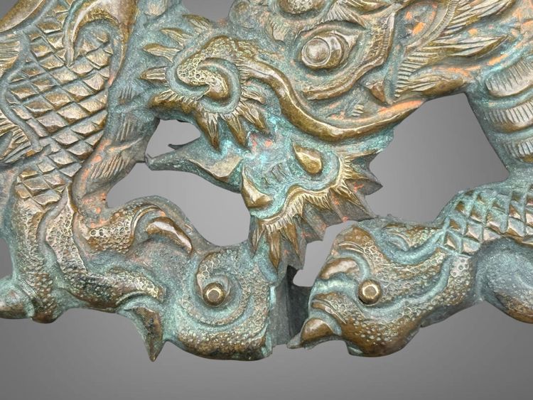 Embossed and finely engraved copper maedate featuring a dragon in clouds - Edo period. -