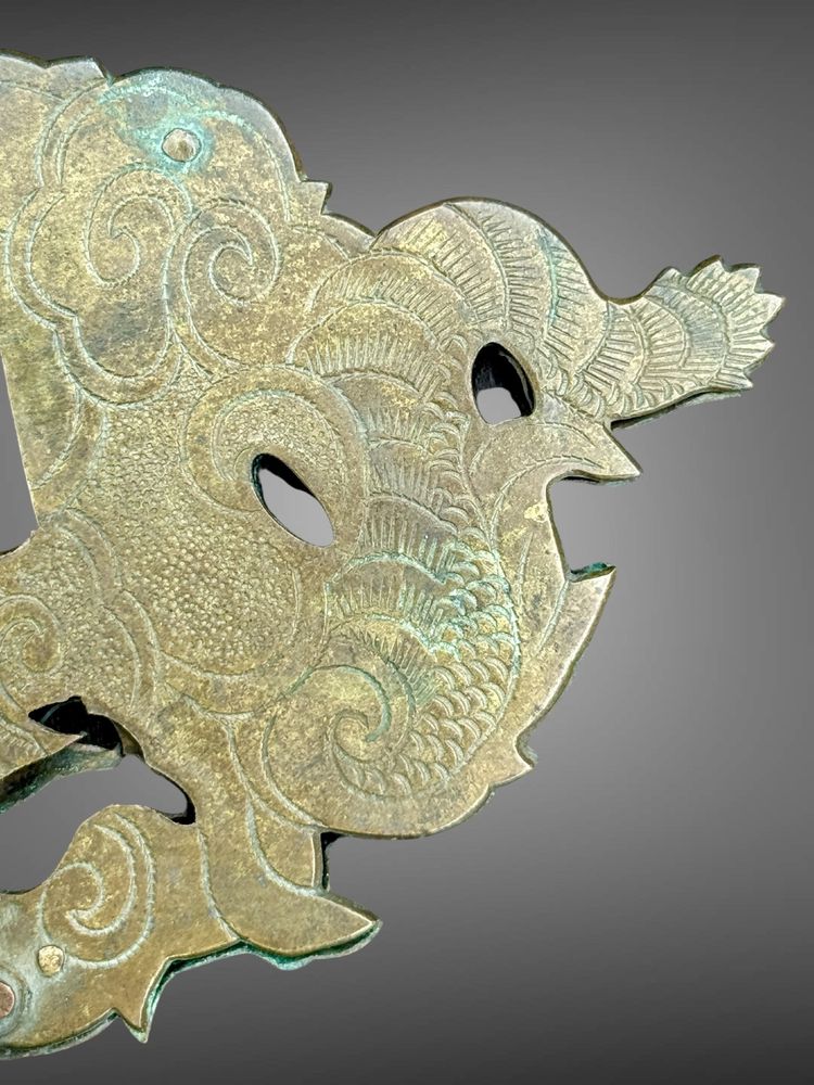 Embossed and finely engraved copper maedate featuring a dragon in clouds - Edo period. -
