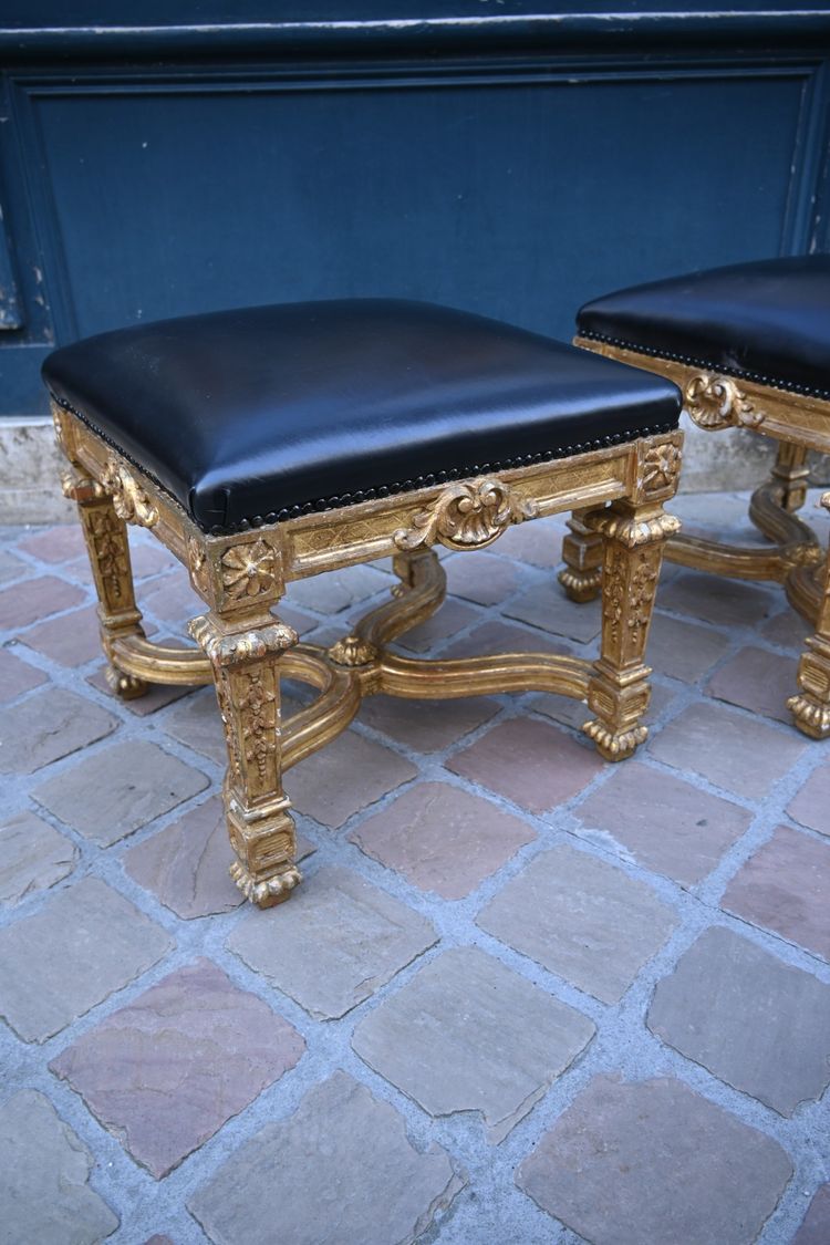 Pair of Louis XIV style gilded wood stools with struts