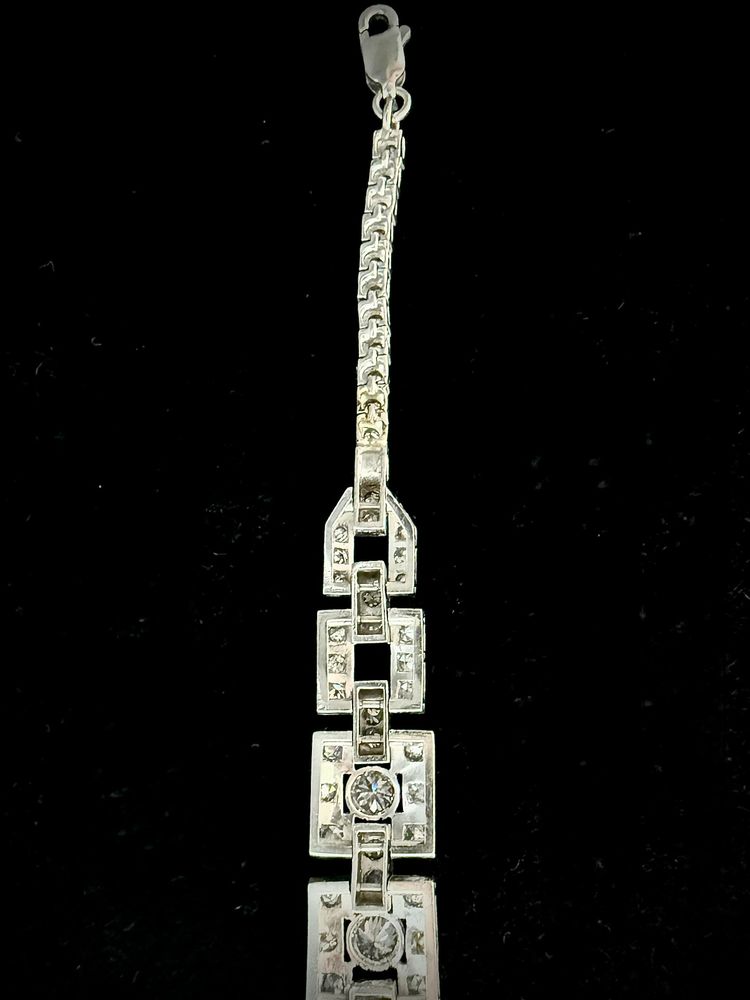 Art Deco bracelet in platinum and gold set with an emerald and 4.72 carats of diamonds