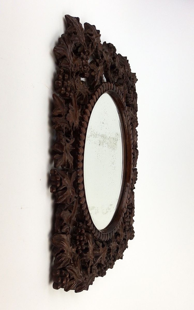 Miroir en bois sculpté