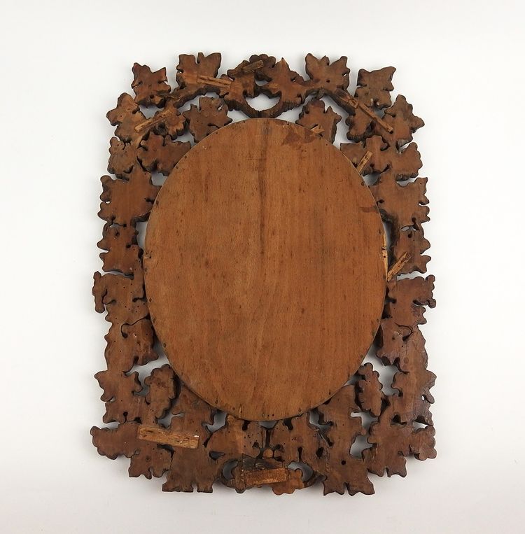 Miroir en bois sculpté