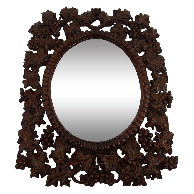 Miroir en bois sculpté