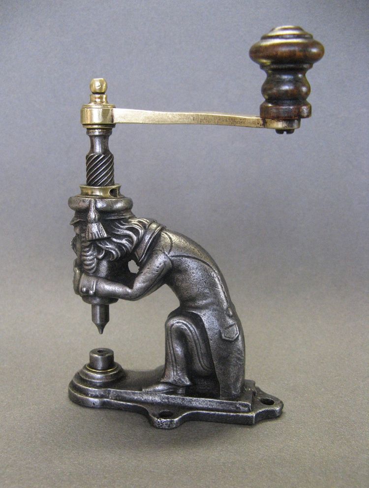 Anthropomorphic eyelet press, 19th century, circa 1800.