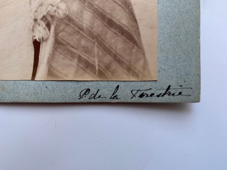 Albumen print photograph of a man with a pipe