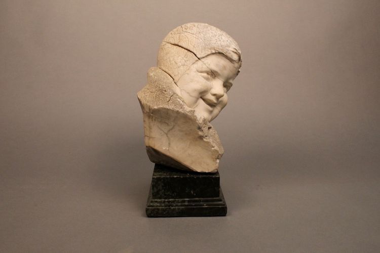 Stone sculpture Child's face 19th century on marble base