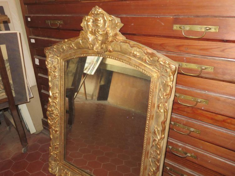 17th century Louis XIV style mirror in gilded wood.