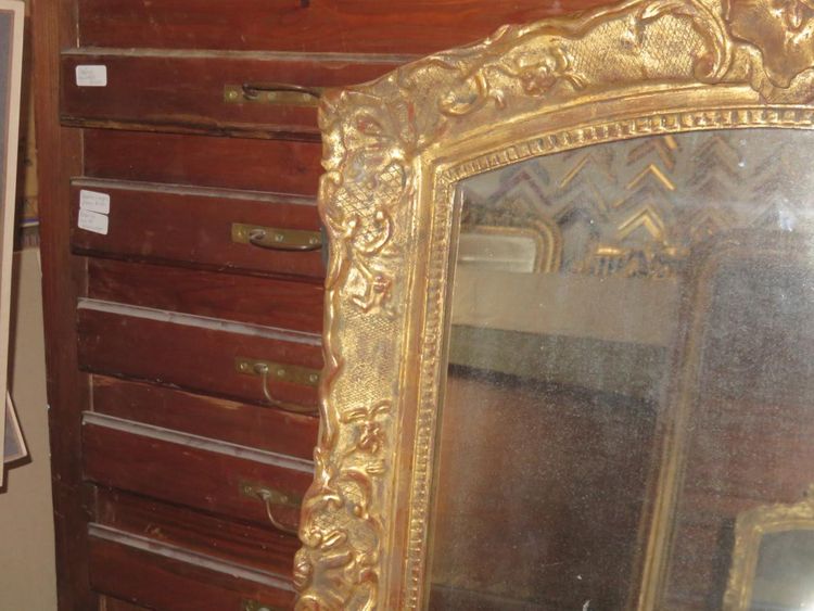 17th century Louis XIV style mirror in gilded wood.