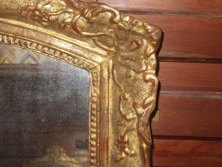 17th century Louis XIV style mirror in gilded wood.