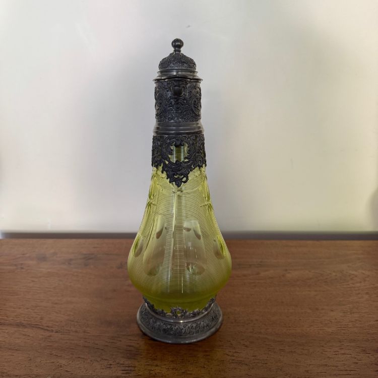 Late 19th century pewter and crystal decanter with green base