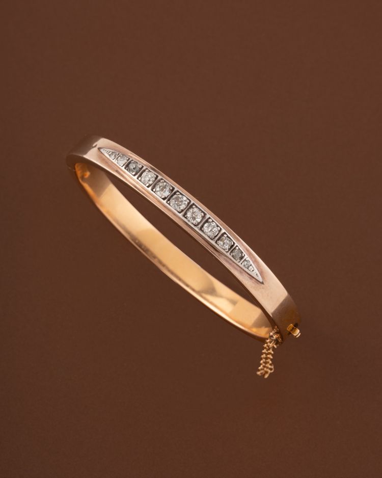 Bracelet rigide ouvrant en or 18k et diamants