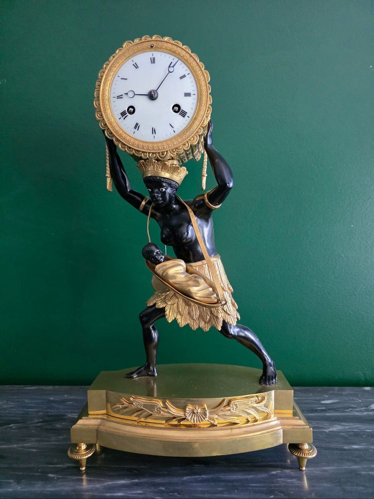 Pendule au bon sauvage : "La nourrice africaine". Époque Empire.