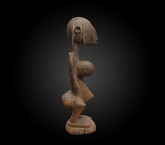 STATUETTE in the style of MOTHERHOOD appearing Ba Fâro Culture Bambara, Mali First half of the 20th century