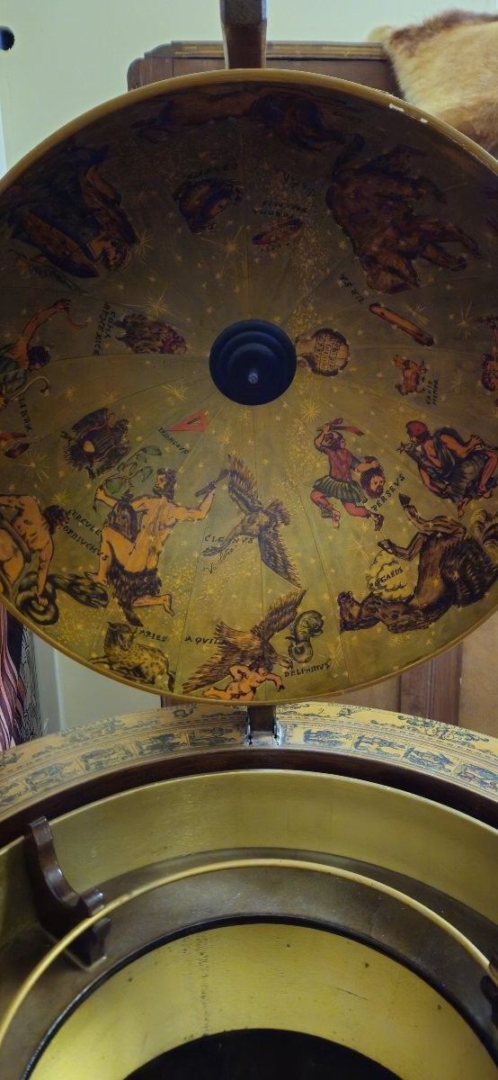 Globe bar opening on tripod base