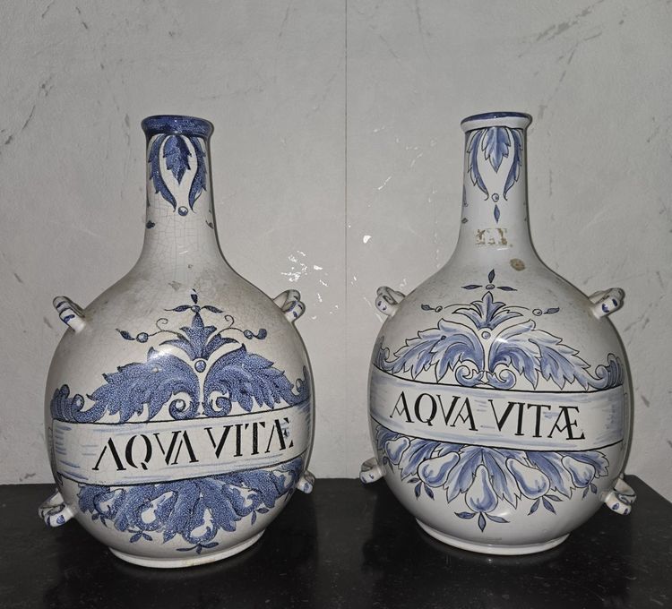 Pair of earthenware pharmacy flasks – “Aqua Vitae” decoration