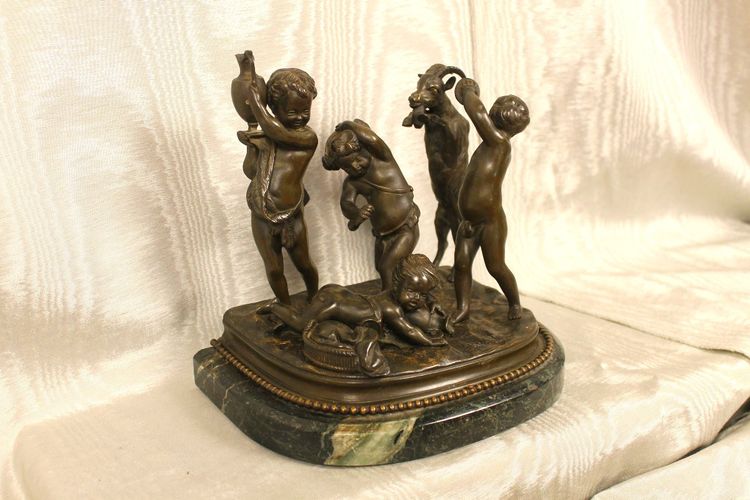 Bronze group on a marble base. Sculpture by Clodion, putti or children and the goat
