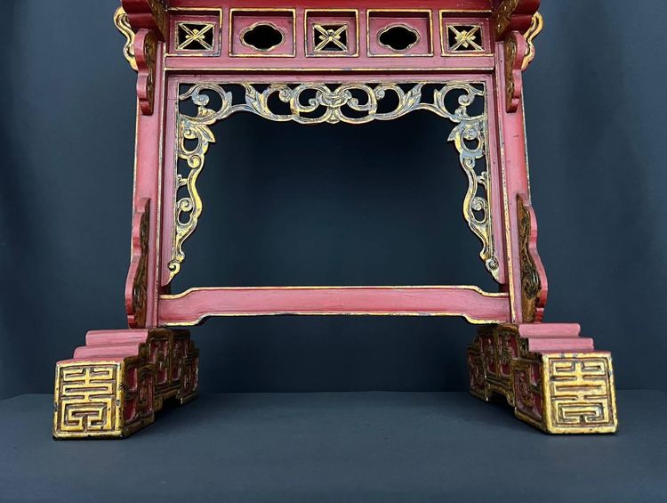 Decorative Asian-style side table in red and gold lacquered wood