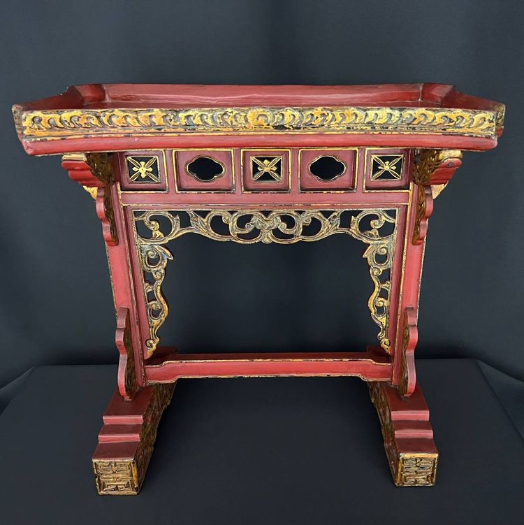Decorative Asian-style side table in red and gold lacquered wood