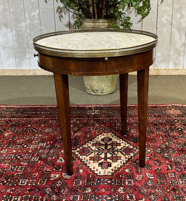Louis XVI style bouillotte table in mahogany with a white marble top, dating from the 1930s