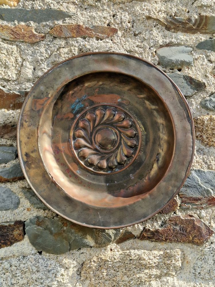 Copper repoussé collection plate, also known as a "quête" plate