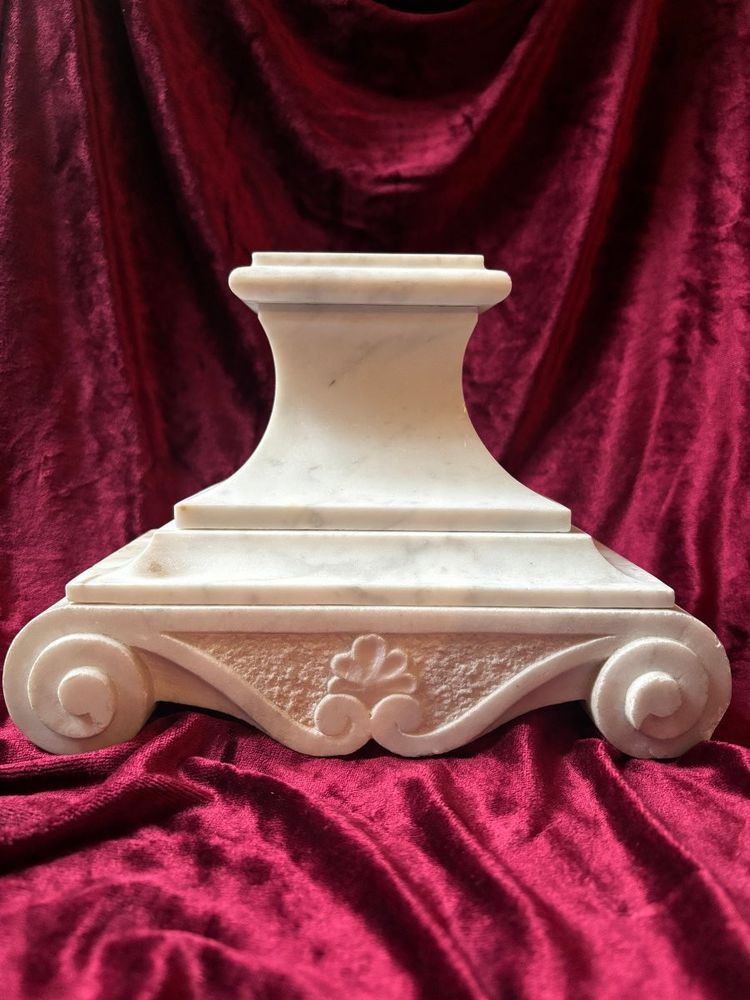 Carved white marble altar base